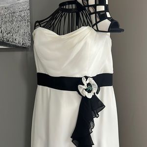 Woman’s size 10, full length formal black and white dress. Has a minimal slit.